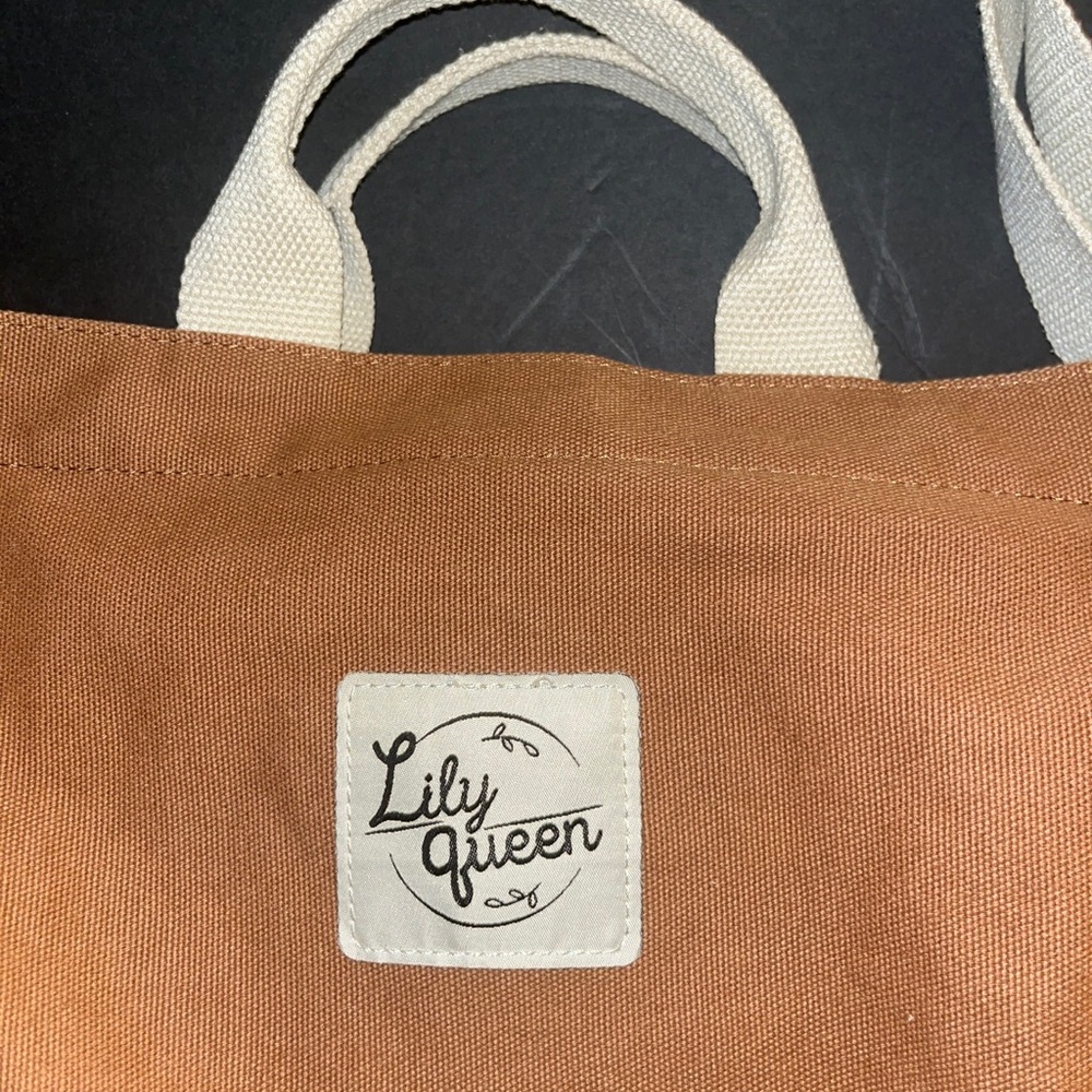 Lily green tan tote bag with zipper and a side pocket for a bottle or cup